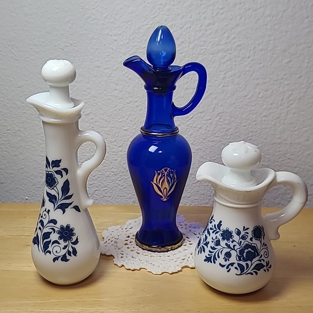 Avon set of three milk glass and blue glass pitcher.
